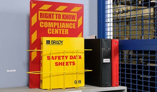 A right to know compliance bin with a safety data sheets binder.