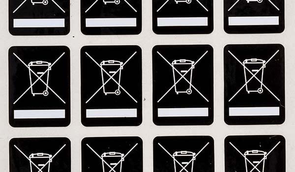 Labels indicating not to throw something in the trash.