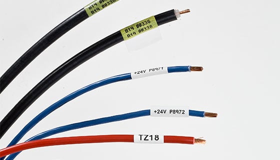 Electrical wires with labels on them.