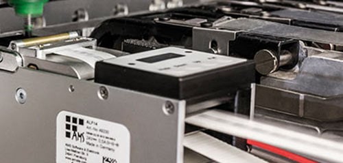 A Brady automated label feeder.