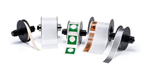 Five different rolls of printer labels.