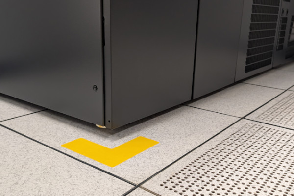 Yellow floor tape showing the placement of a server rack