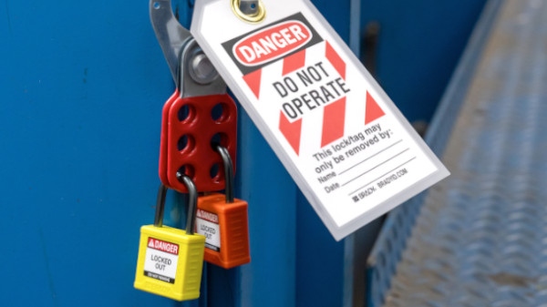 A yellow and red Velocity Padlock with a "Do Not Operate" tag.