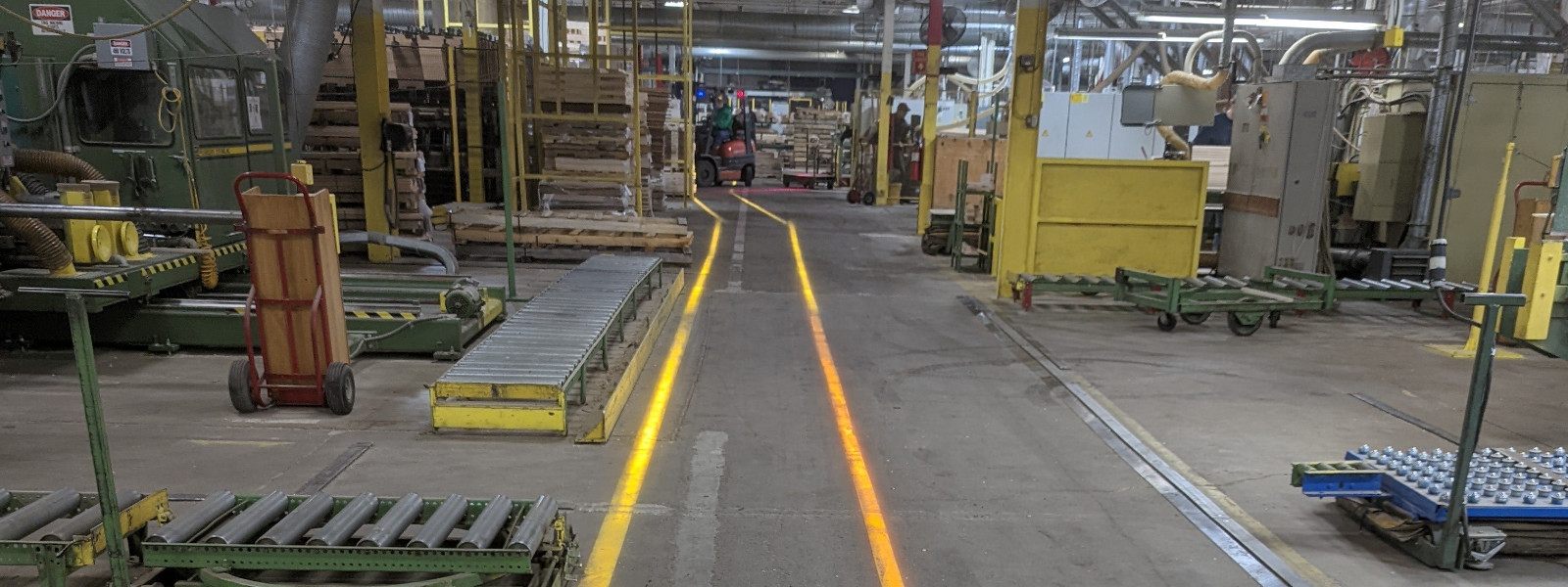 Projected lines on a factory floor.