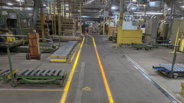 Projected lines on a factory floor.