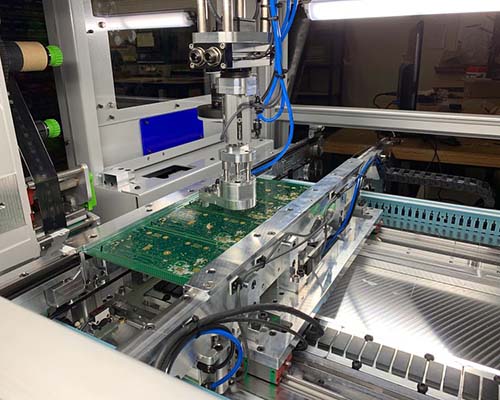 A circuit board on an automated manufacturing line.