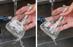 Water dissolvable paper labels being rinsed.