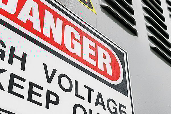 Danger sign on an outdoor vent duct.