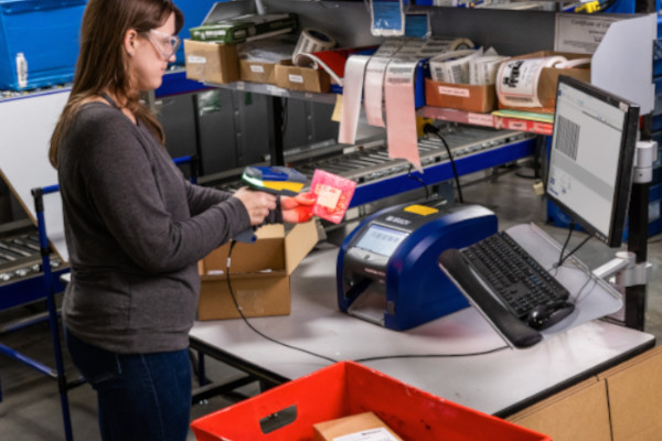 Person using a Brady V2200 Wired Industrial Barcode Scanner