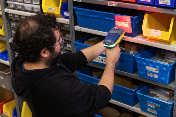 Brady V3200 Wireless Industrial Barcode Scanner being used in a warehouse
