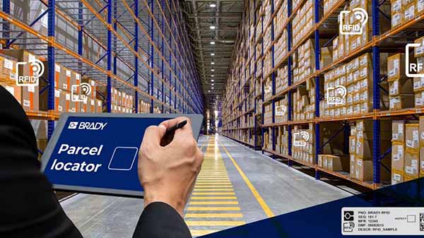 Person holding tablet in warehouse