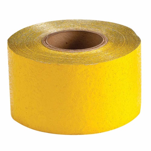 Closeup on roll of yellow pavement marking tape.