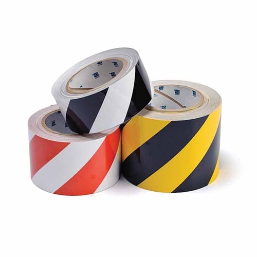 Three rolls of Brady striped ToughStripe floor marking tape.