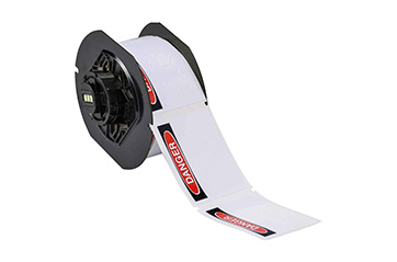 A roll of pre-printed header safety labels.