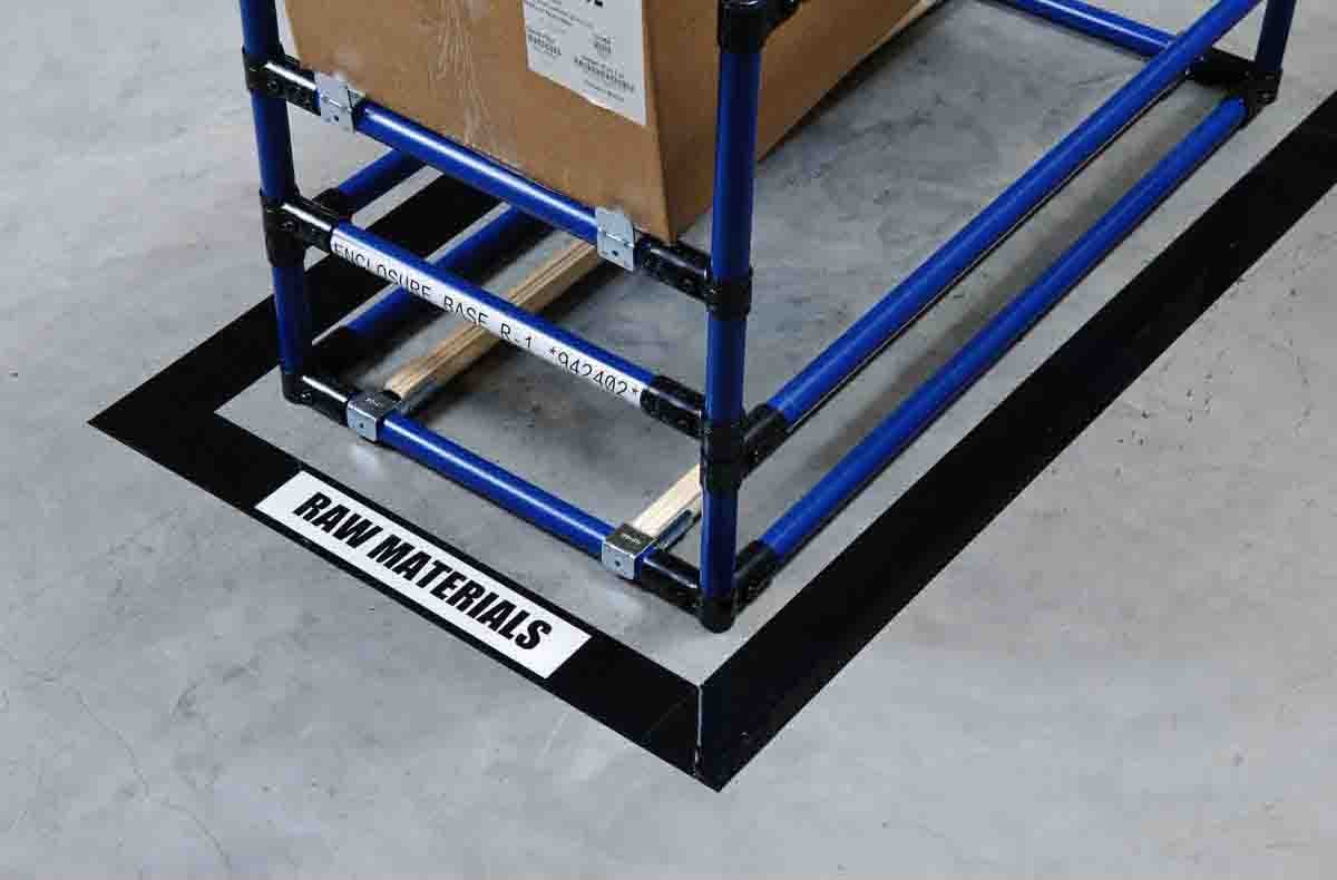 Floor marking tape around industrial equipment.