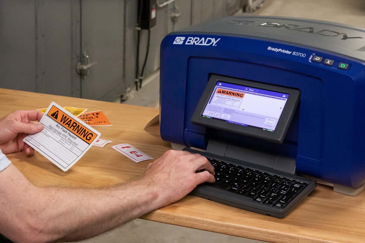 Person printing arc flash label on S3700 printer.