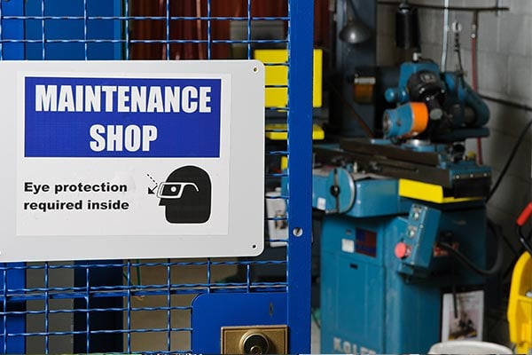 A sign identifying eye protection in the maintenance shop.