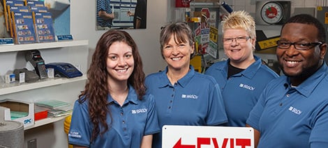 Four Brady employees standing together