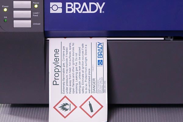 A GHS label printed on a Brady printer.