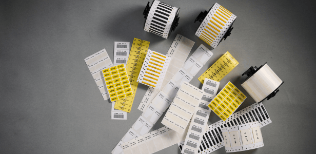 Collage of assorted Brady wire and cable ID labels 