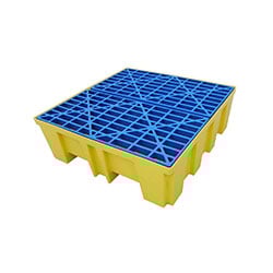 A blue grate with catch bin below. Fit for drum storage.