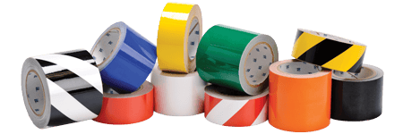 A collection of rolls of floor tape in various colors.