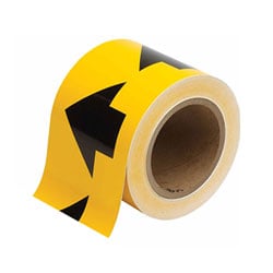 a roll of yellow tape with black arrows