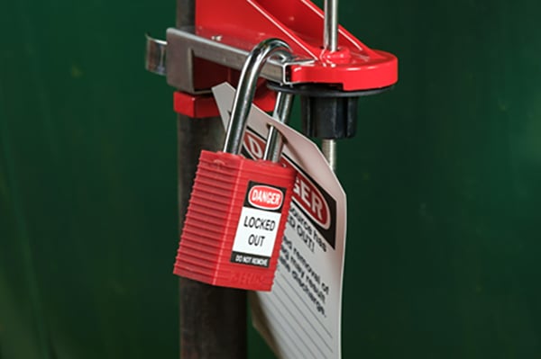 A padlock and tag attached to a device.