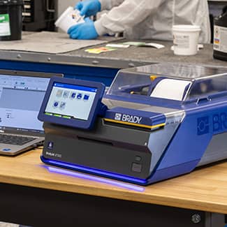 A J7300 printer on a workbench highlighting its large, clear LED screen.