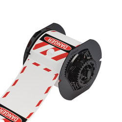 a printer cartridge roll of blank tags with the Danger warning